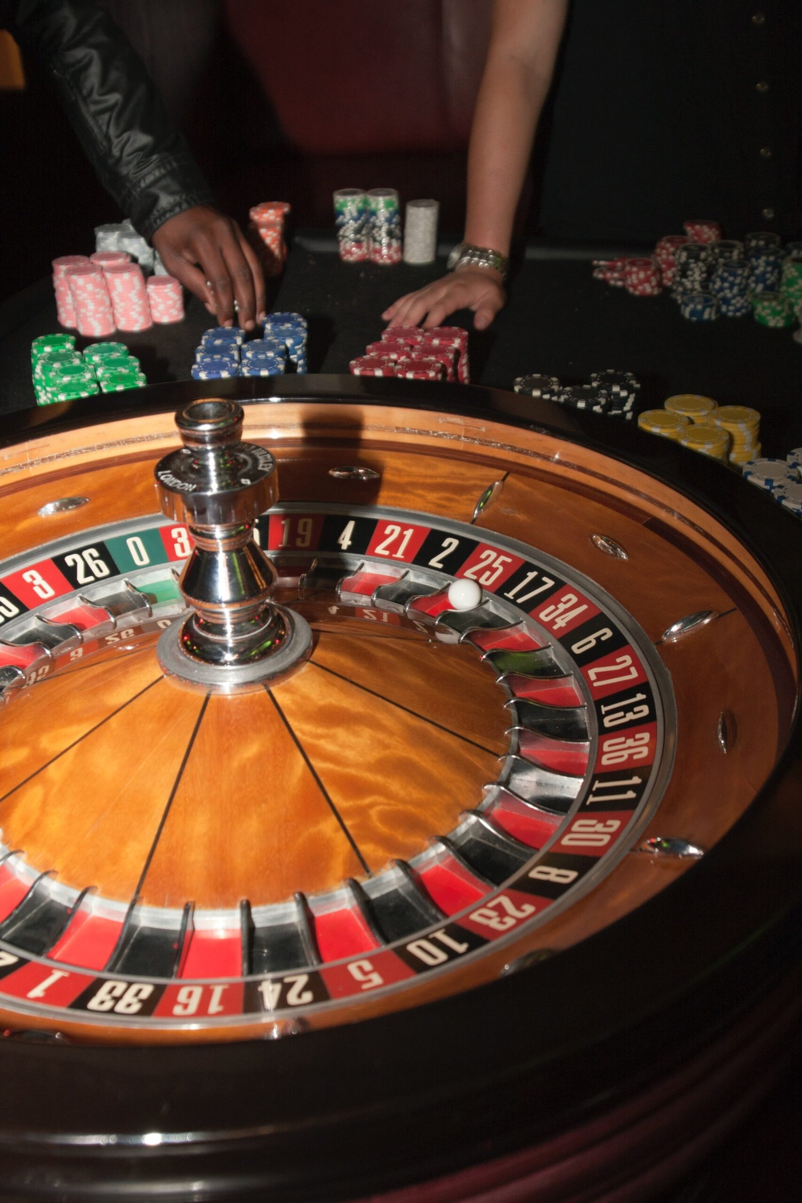 stainless steel round table on brown wooden table